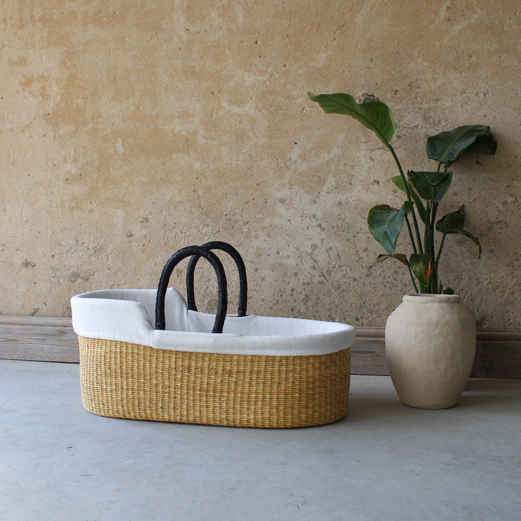 Esi natural grass handwoven african baby moses basket with black leather handles