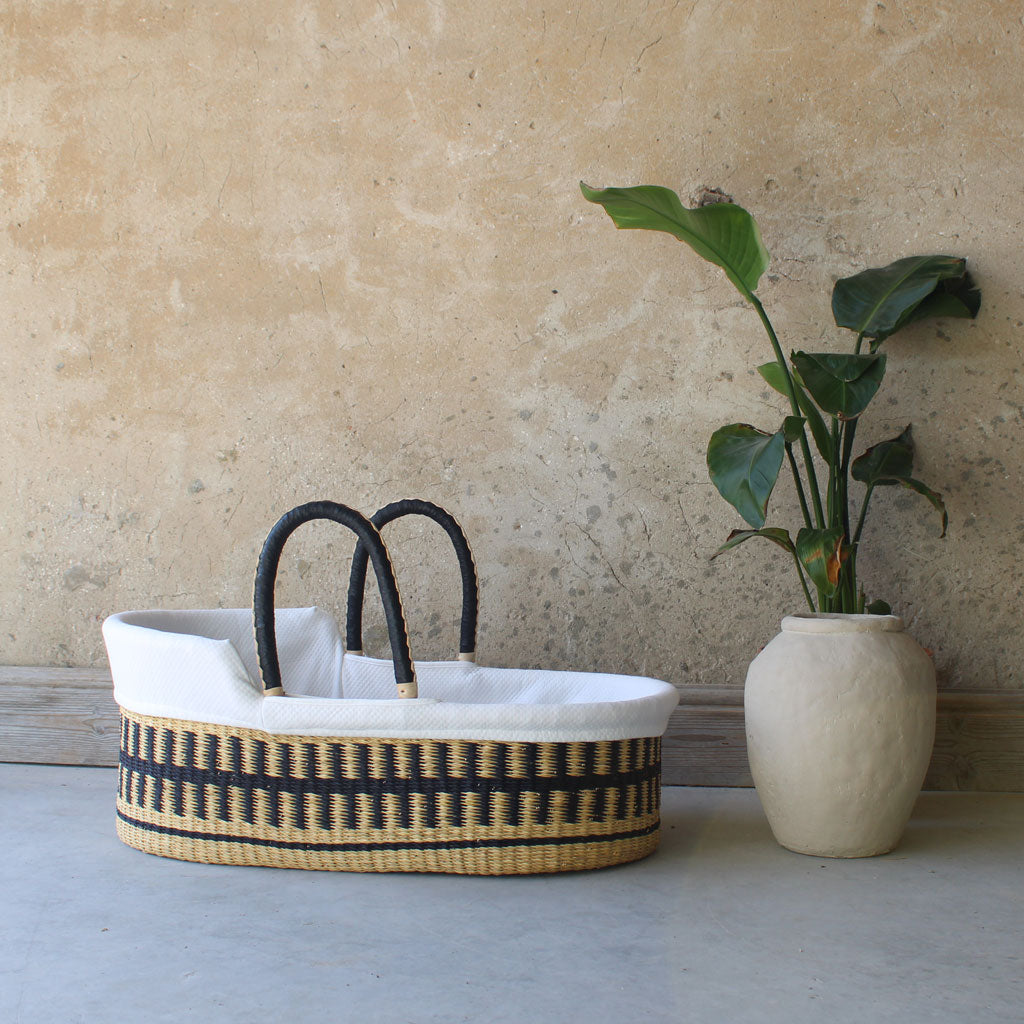 Jojo Mono natural woven moses basket black and cram leather handles handles baby beds by the little rattan company