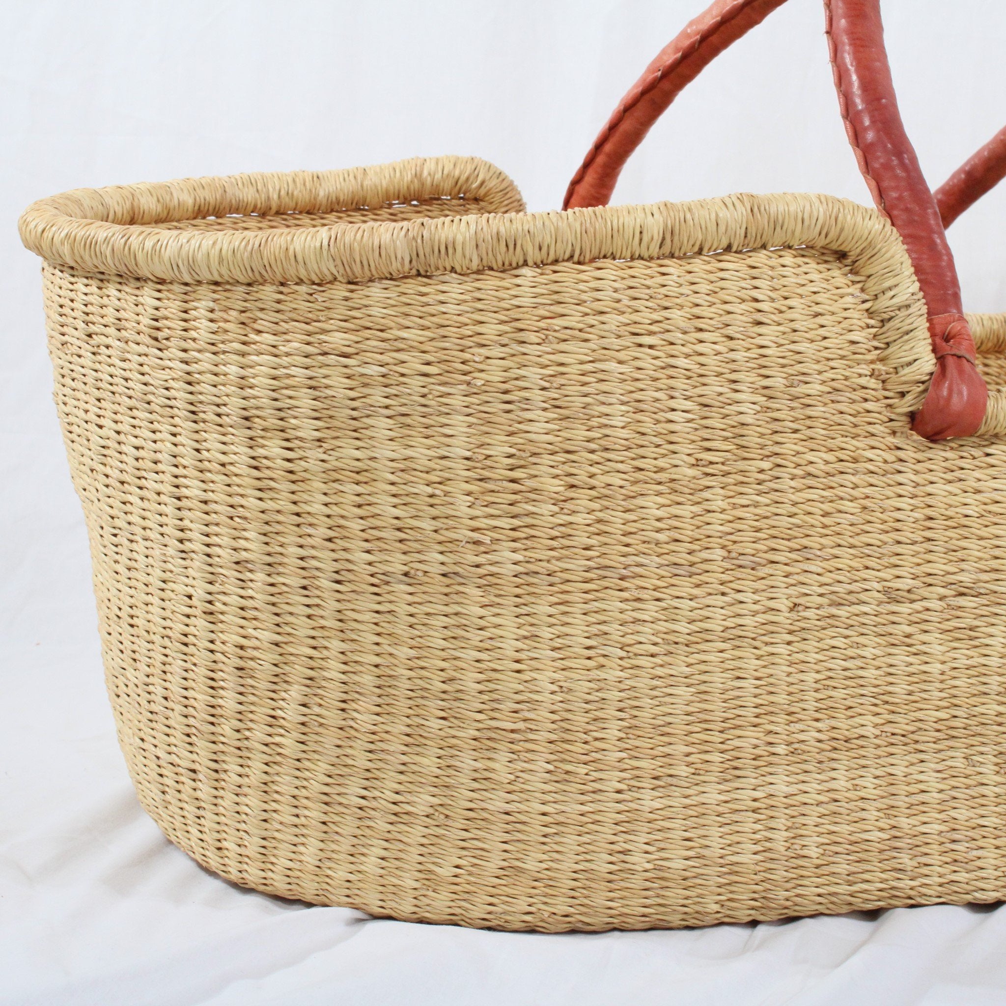 Esi handwoven moses basket with tan leather handles including  mattress and liner