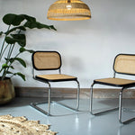A Pair of Cesca Dining Chairs in Ash Wood with Natural Rattan Seat and Back and Chrome Steel Frame - In Black