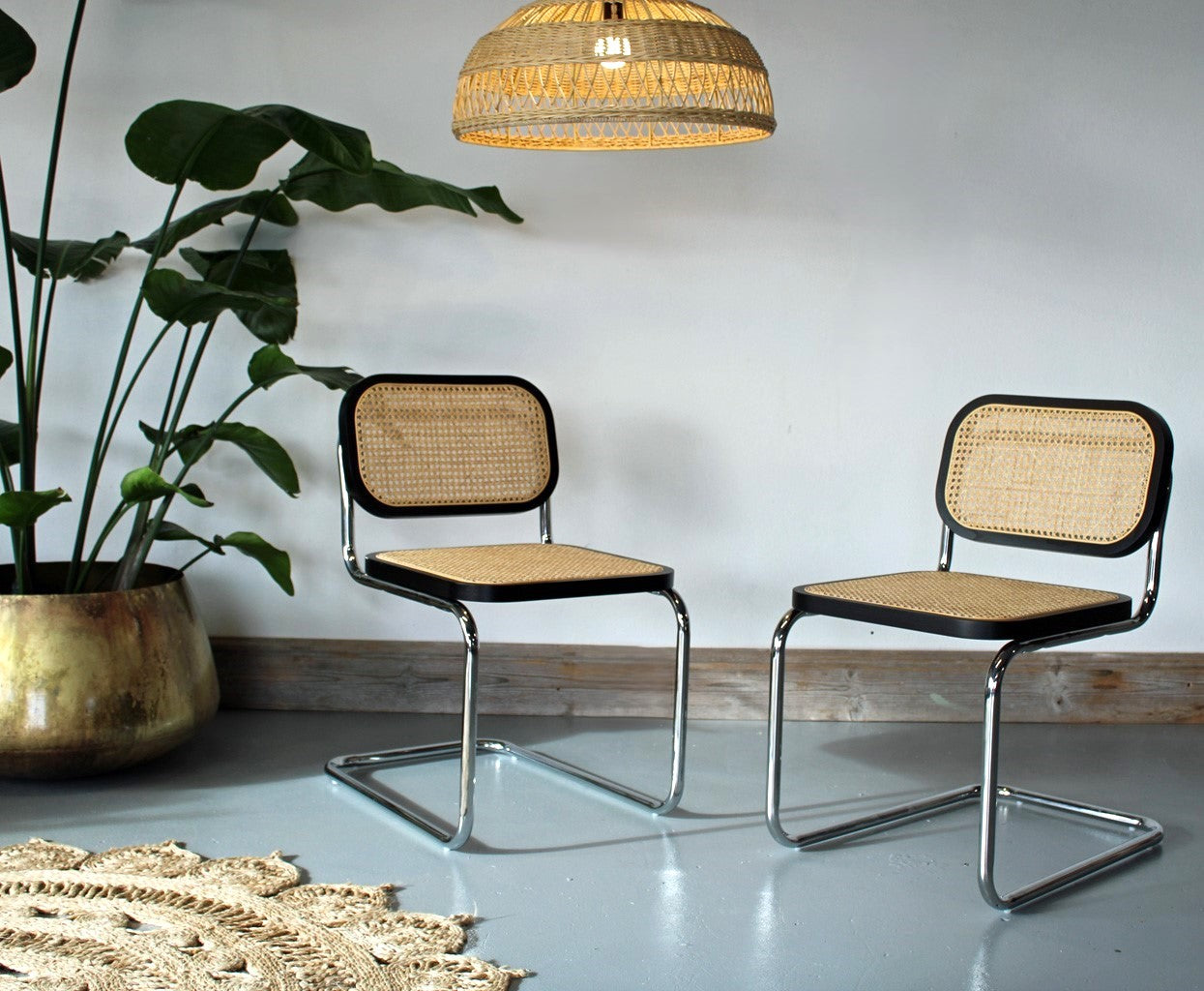 A Pair of Cesca Dining Chairs in Ash Wood with Natural Rattan Seat and Back and Chrome Steel Frame - In Black