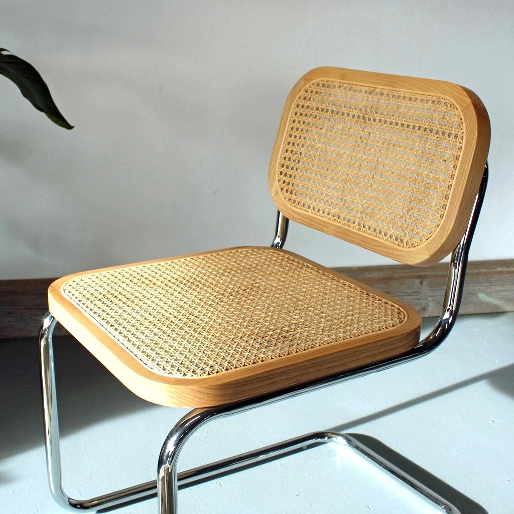 A Cesca Dining Chair in Ash Wood with Natural rattan and Chrome Steel Frame