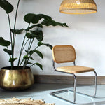 A Cesca Dining Chair in Ash Wood with Natural Rattan Seat and Back and Chrome Steel Frame