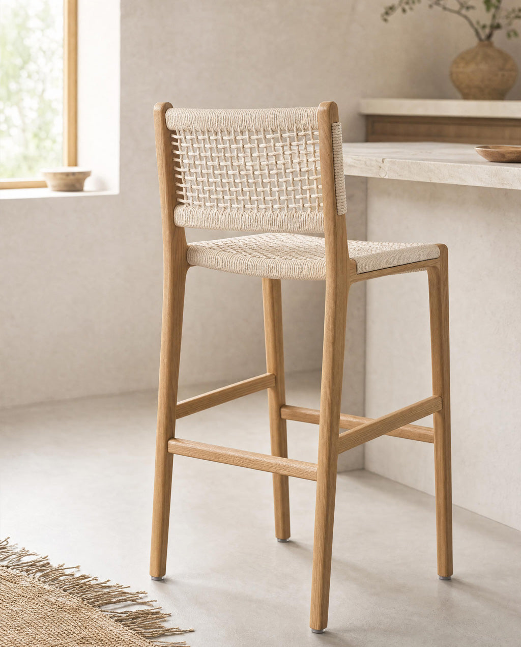 A pair of Inca Natural Ash Wood and Paper Cord Bar Stools